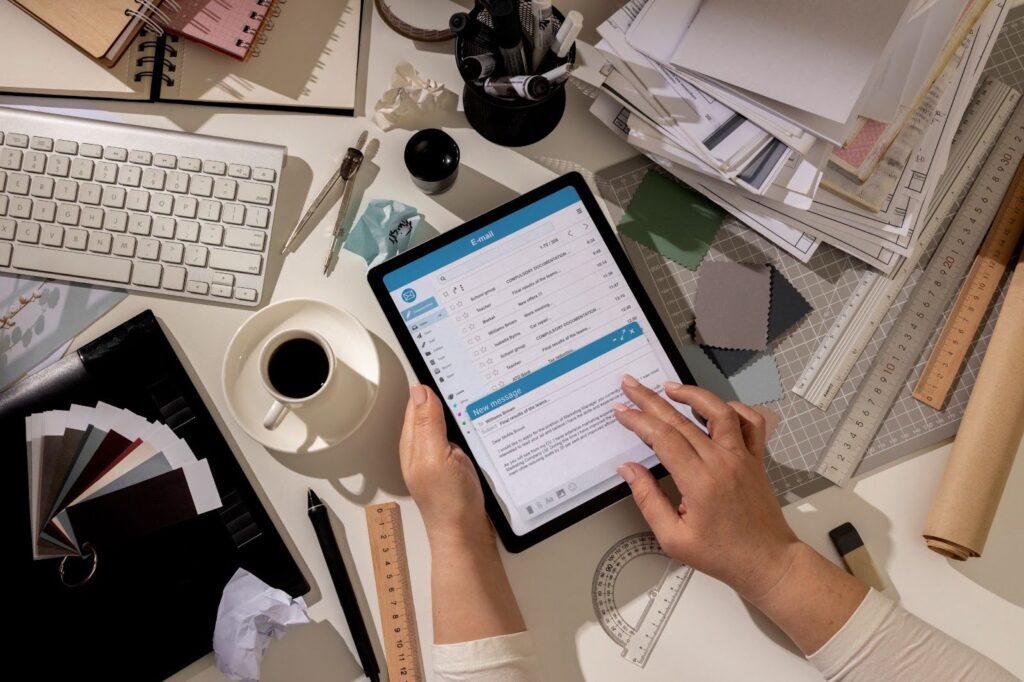 Image of a man working on his tablet, managing tasks with an app for remote team members.